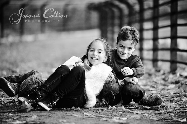 onlocation photography mote park maidstone kent siblings rolling around on the path