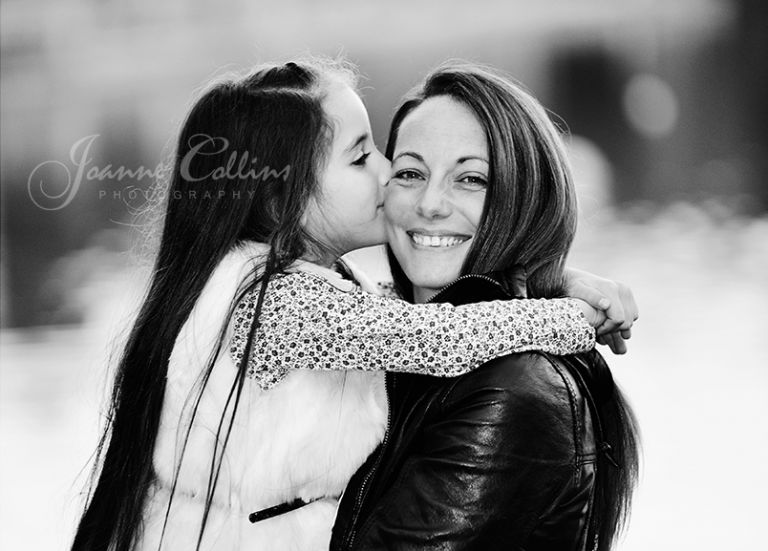 onlocation photography maidstone kent daughter kissing mum whilst she smiles
