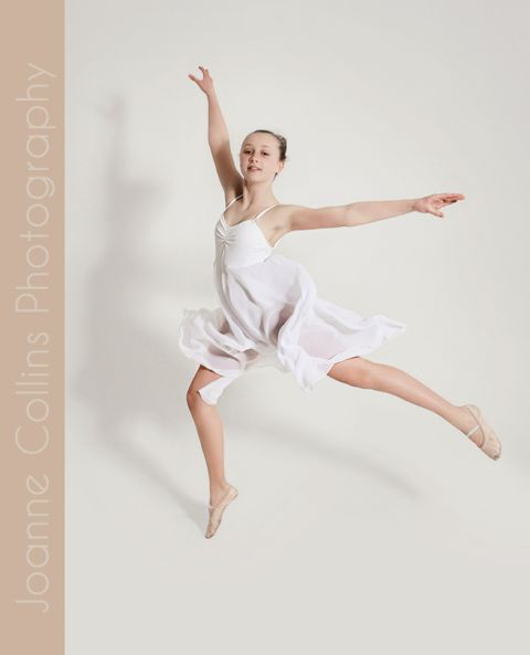 studio photographer kent dance model portfolio young teen in ballet dress performing a dance jump
