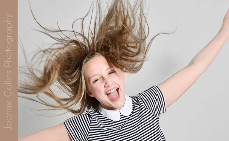 studio photographer maidstone young teen laughing hair everywhere model portfolio shot