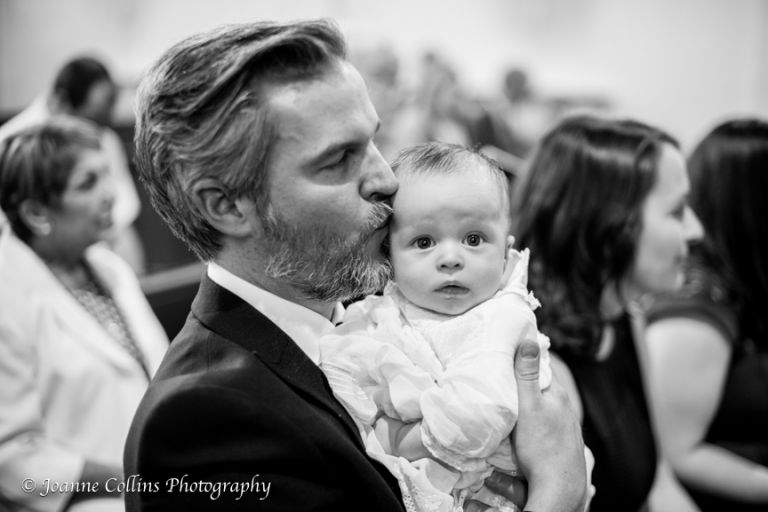 Christening Photographer Sevenoaks st thomas of canterbury church father kissing baby