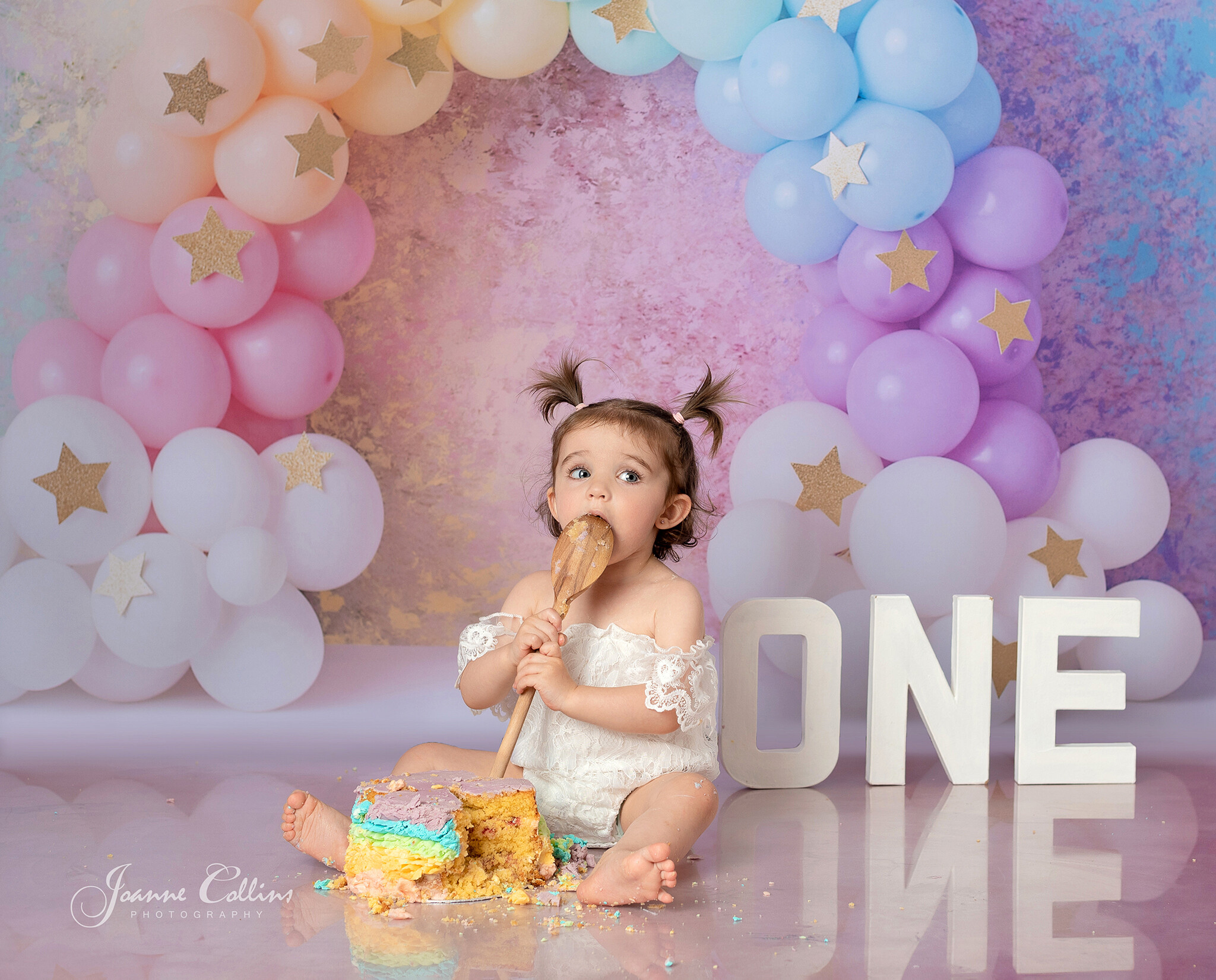 cake smash photographer sittingbourne kent rainbow cake girls first birthday photoshoot