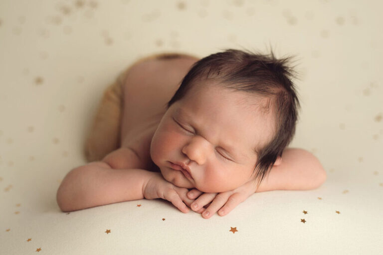 Newborn Photography Training and baby safety beautiful baby boy is chin on hands pose